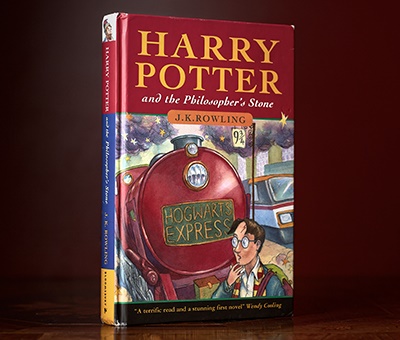 ROWLING, J.K. | HARRY POTTER AND THE PHILOSOPHER'S STONE London: Bloomsbury, 1997. First edition, hardback, first impression with the '10 9 8 7 6 5 4 3 2 1' numberline on the publisher's imprint page and '1 wand' listed twice on p.53, inscribed and signed by J.K. Rowling on the front free-endpaper Sold for £125,000 incl premium
